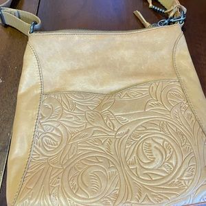 The Sak messenger bag tan leather embossed floral